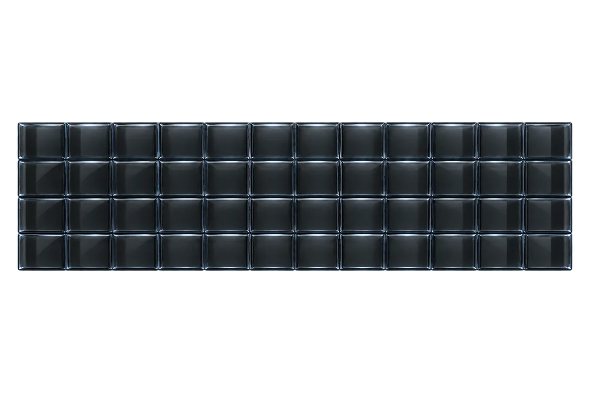 A wide arc of smoked glass tiles fanned across the frame