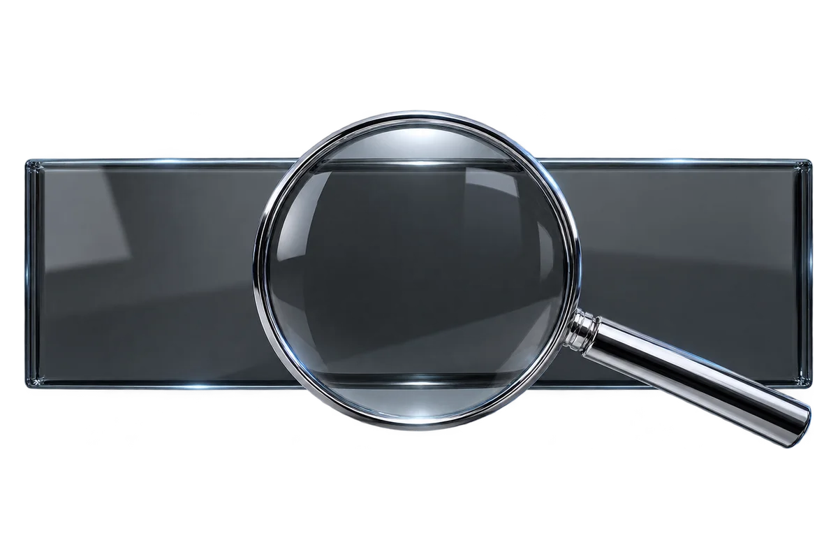 A smoked glass panel examined through a chrome magnifier
